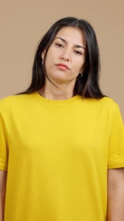 Woman Looking Down with Disappointed Expression
