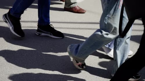 Casual and Trendy Footwear in Motion on a Busy Urban Street Reflecting the Diversity and Style of