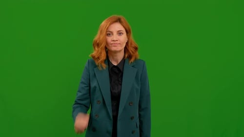 Angry aggressive woman trying to fight at camera shaking fist showing rage.