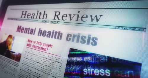 Mental health crisis newspaper on mobile tablet screen