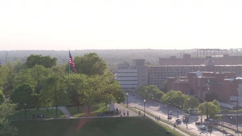 City Aerial View with Flag and People
