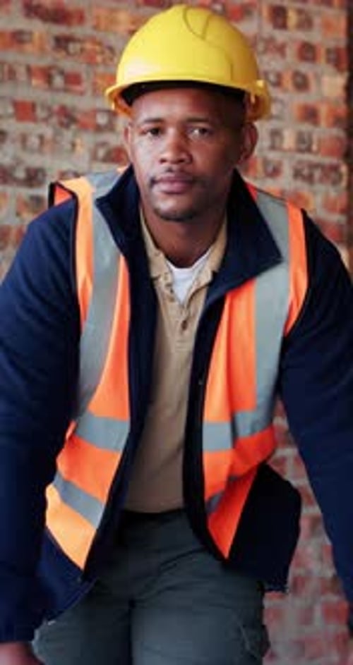Construction, happy and face of black man in building for renovation, remodeling and infrastructure