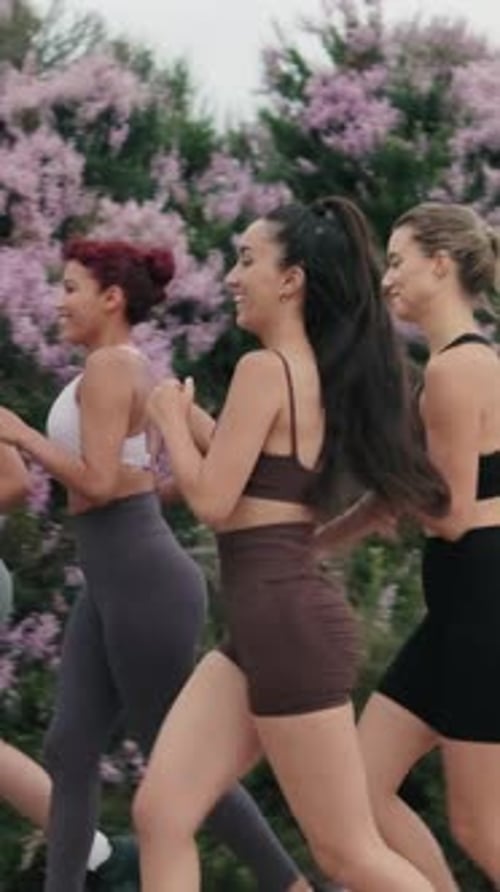 Athletic Young Women Jogging Outdoors Together