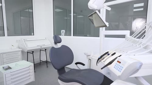 Dental Chair in Stomatology Office with Professional Modern Equipment Dentist's Office Interior with