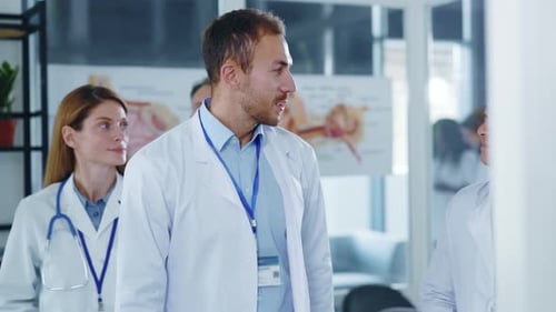 Medical Staff Applauding Achievements in Hospital Environment