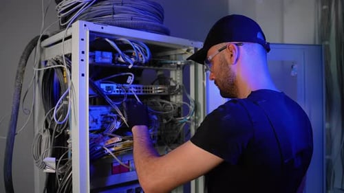 It Engineer Setting Up Server While Working with Data Network