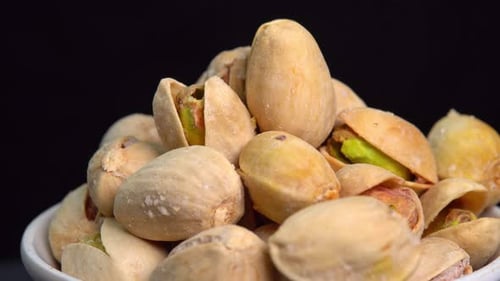 Close Up of Pistachios in a White Bowl