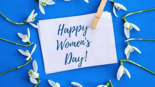 Greeting Card surrounded by Snowdrop Flowers