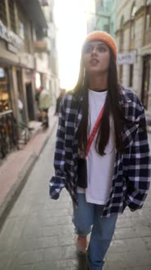 Exploring Urban Fashion Trends in a Vibrant City Street During a Bright Daytime Outing