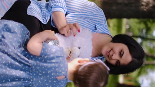 Mother and child together in the park outdoors, lying in the grass. Motherhood happiness concept. Da