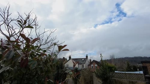 Static time lapse of slow moving clouds, in the back garden.