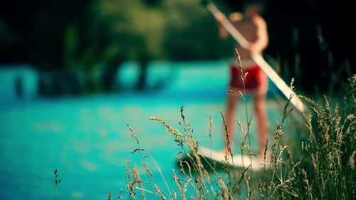 Paddleboarding on Lake on a Summer Day
