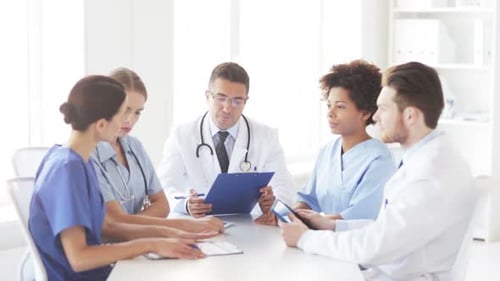 Multiethnic doctors meeting discussing medical problem at hospital conference