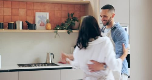 Happy Couple Dancing Together in Their Kitchen