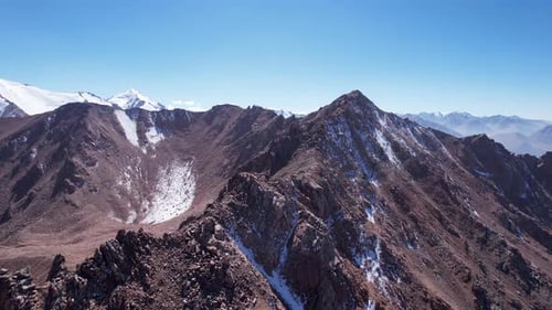 Snowy Rocky Mountain Peaks in a Light Haze