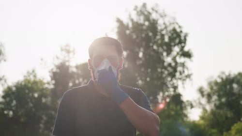Adult Wearing Mask and Gloves Outdoors