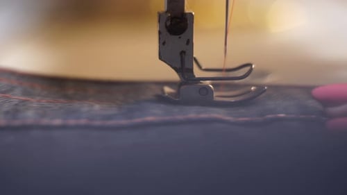 Close Up Macro Shot of Female Hands Working on Sewing Machine Near Presser Foot and Needle Caucasian