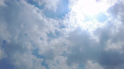 Fluffy White Clouds Against a Blue Sky
