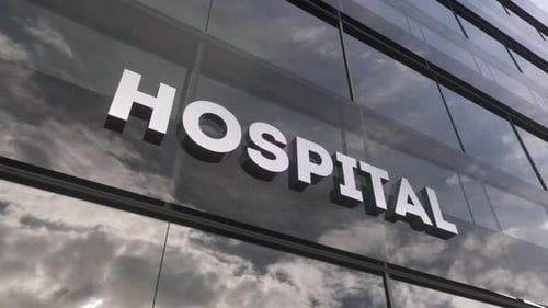 Hospital Sign on a Modern Glass Skyscraper