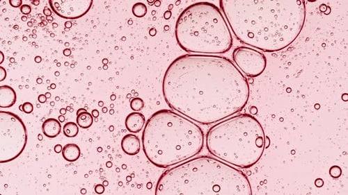 Bubble Cluster Cells Under a Microscope Transparent Cosmetic Gel Fluid with Molecule Bubbles Oil