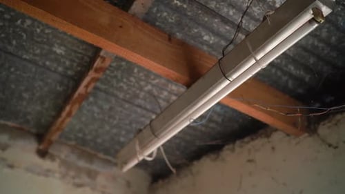 Exposed Beams and Fixture in Unfinished Interior Space