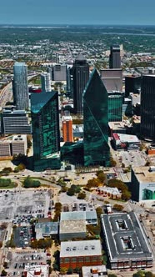 Aerial view of Dallas showcasing urban landscape in sunny weather