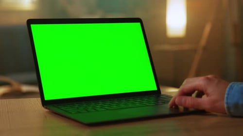 At Room Hands of Freelancer Use Laptop with Green Screen Working Scrolling Through Website Typing on