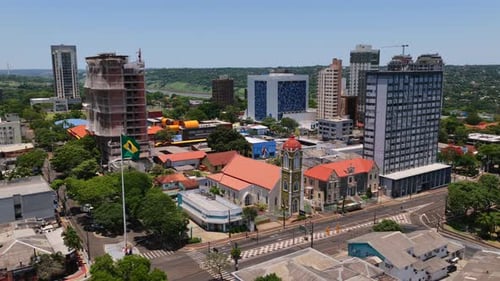 Aerial shot of Paróquia São João Batista among modern buildings in downtown Foz do Iguaçu, Brazil