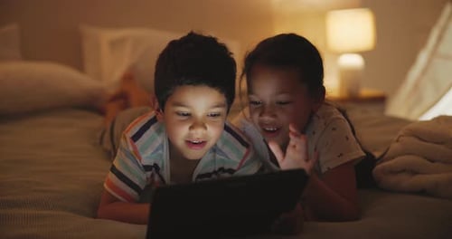 Children Enjoying a Tablet Together at Home