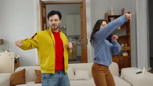 Family Having Fun Dancing Together at Home