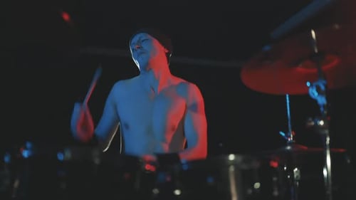 Rock Band Drummer Playing Drums Energetically