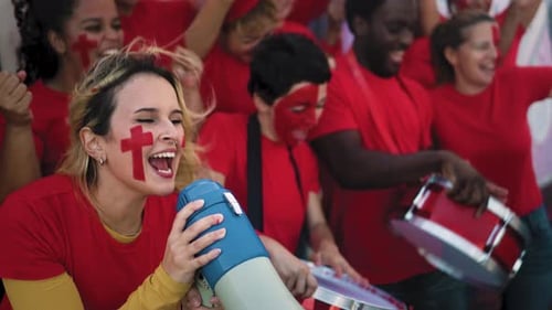 Enthusiastic Fans Cheering Team with Megaphone and Drums