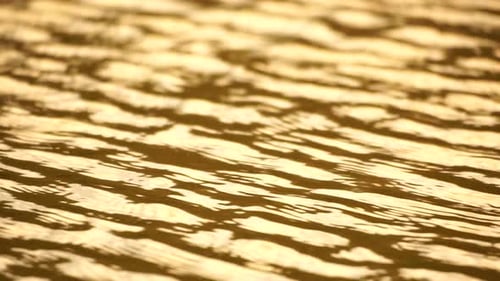 Sun Reflecting on Sparkling Sea Lake Water Surface Ocean at Sunset Sunrise