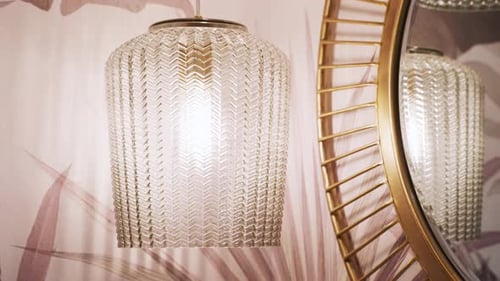 Elegant Glass Lamp Hanging Near Golden Frame Mirror. Closeup Shot