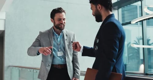 Happy, businessmen and meeting with fist bump at office building for corporate discussion