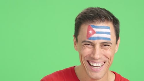 Smiling Man with Painted Flag on Forehead