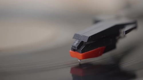 Close up of a needle Vinyl Record player Spinning.