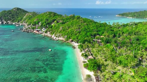 Sandy beach coastline in a tropical island in Thailand from aerial view.