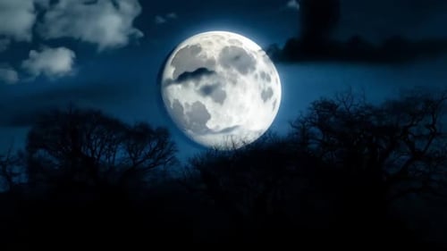 Dramatic Full Moon with Moving Clouds in Dark Night Sky