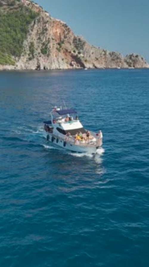 Vertical Video Coastal Wonders Azure Sea and Elegant Yachts