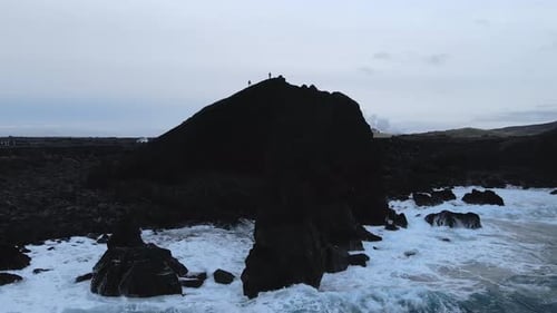 Aerial Seascape South Coast of Iceland. Waves Crashing to Black Rocks on Shore