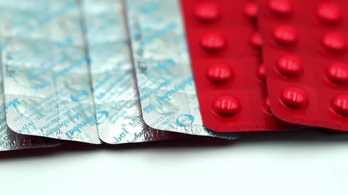 Packages of Red and Silver Pills