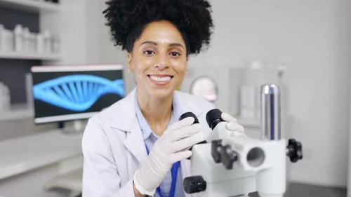 Woman Scientist Works with Microscope in Lab
