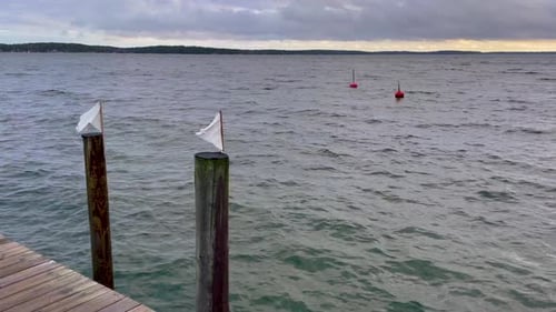 Serene maritime view of Swedish archipelago with buoys, posts and open sea horizon