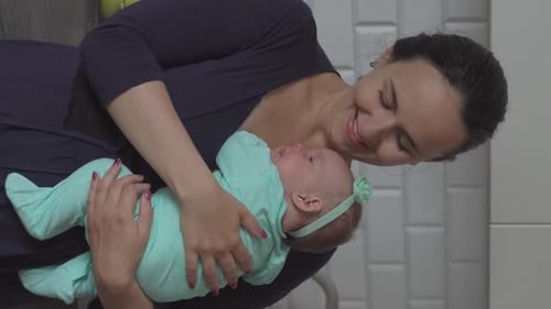 Young Mother Holding and Hugging Child