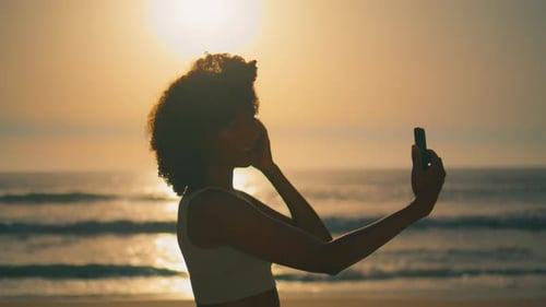 Smiling Woman Making Selfie at Sunrise on Ursa Beach Closeup
