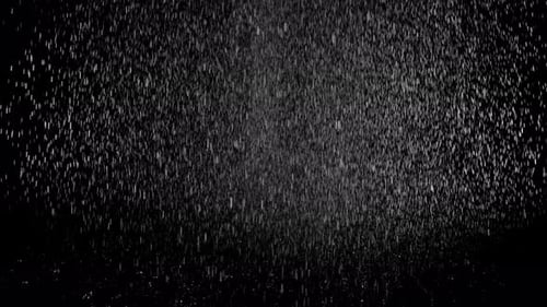 Submerge Collection: Heavy rain falling from the top on a black background