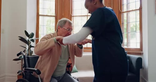 Caregiver Helping Senior Man with Arm Exercises