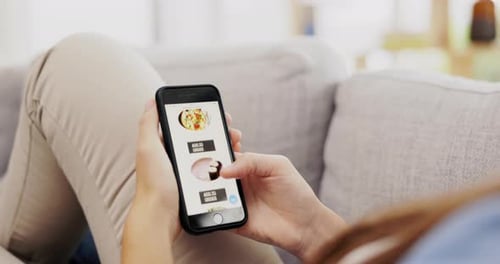 Hands, phone screen and online shopping for food in home on sofa in living room