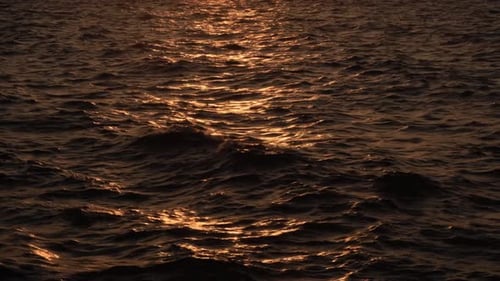 The sea's surface glittered with sparks.